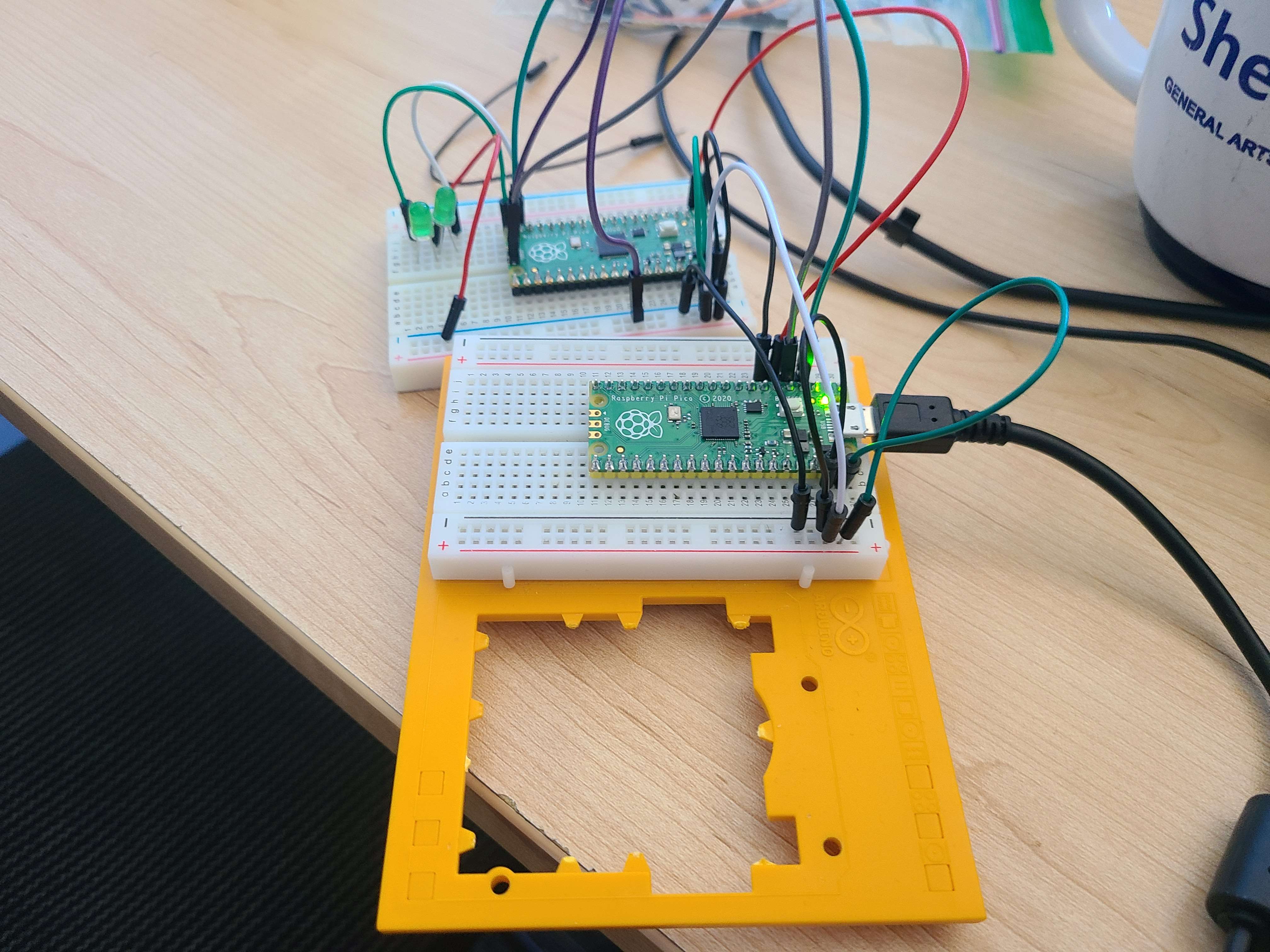 (Bottom to top) debug probe, and Pico running the actual program